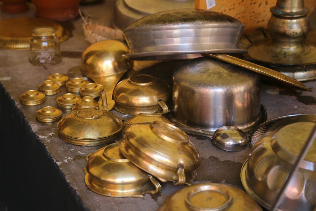 Traditional round metal vessels used in home decor