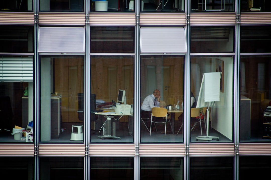 Thoughtful professional reflecting on work and wellbeing
