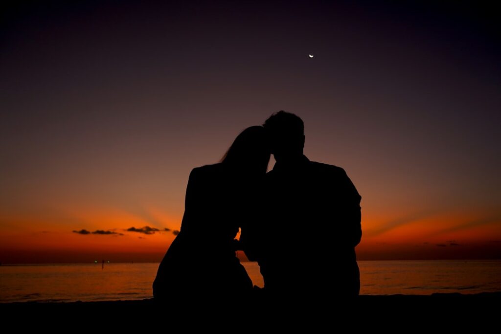 Couple silhouette representing relationship distance in astrology