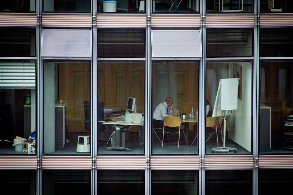 Thoughtful professional reflecting on work and wellbeing