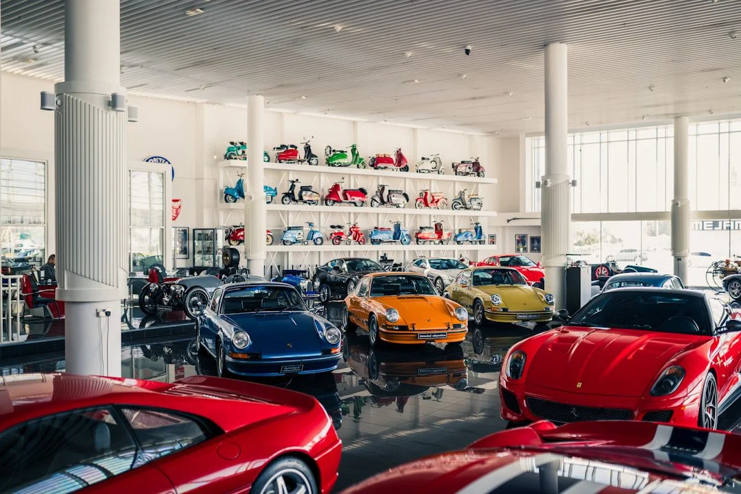 Cars in different colours displayed in a premium showroom
