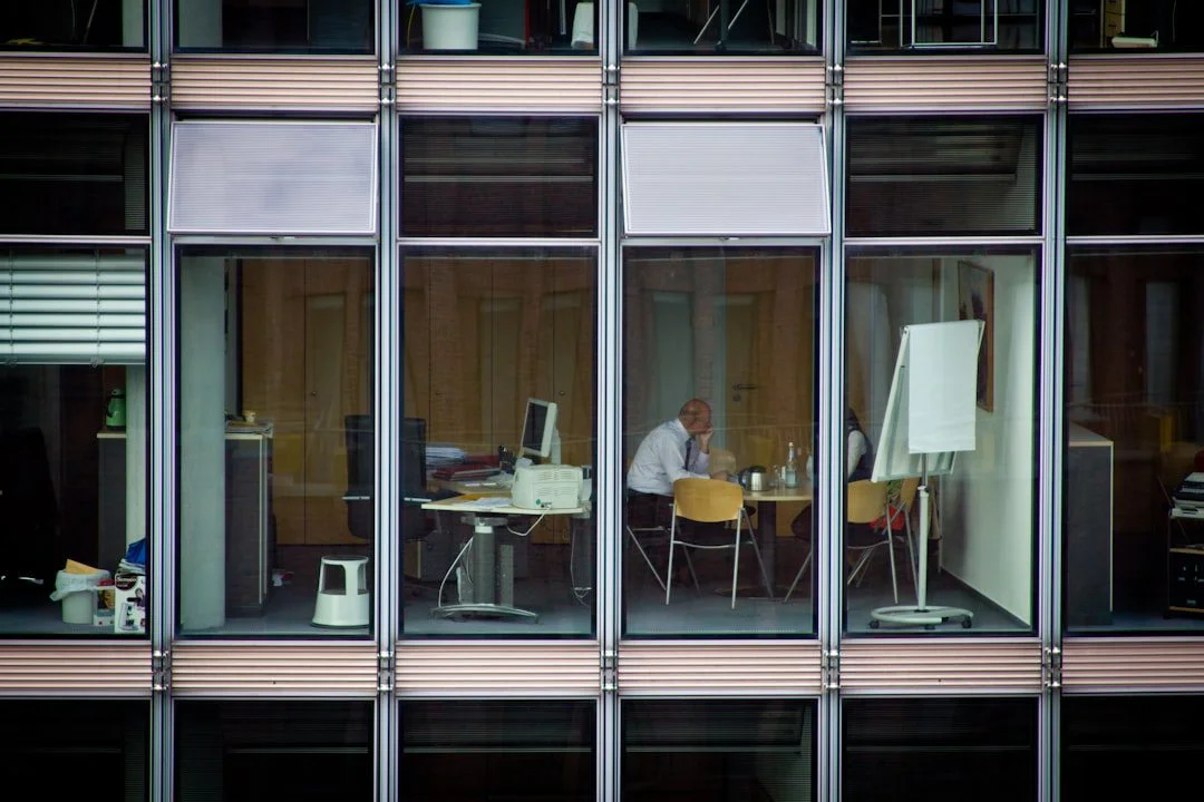 Thoughtful professional reflecting on work and wellbeing