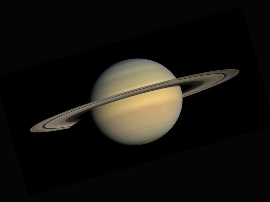 Saturn in deep space representing its astrological transit